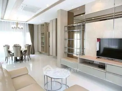 Luxurious modern living room with elegant dining area and sleek TV setup