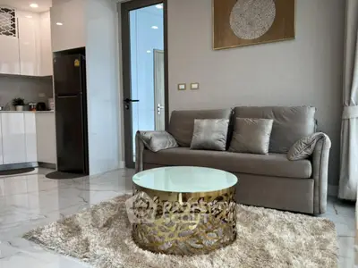Modern living room with stylish decor and open kitchen layout