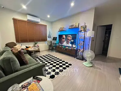 Modern living room with stylish decor, cozy seating, and entertainment setup, perfect for relaxation and leisure.
