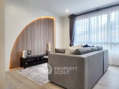 Modern living room with stylish sofa and natural light