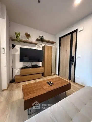 Modern living room with stylish wooden furniture and wall-mounted TV, perfect for cozy relaxation.