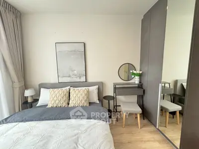 Modern bedroom with stylish decor and mirrored wardrobe