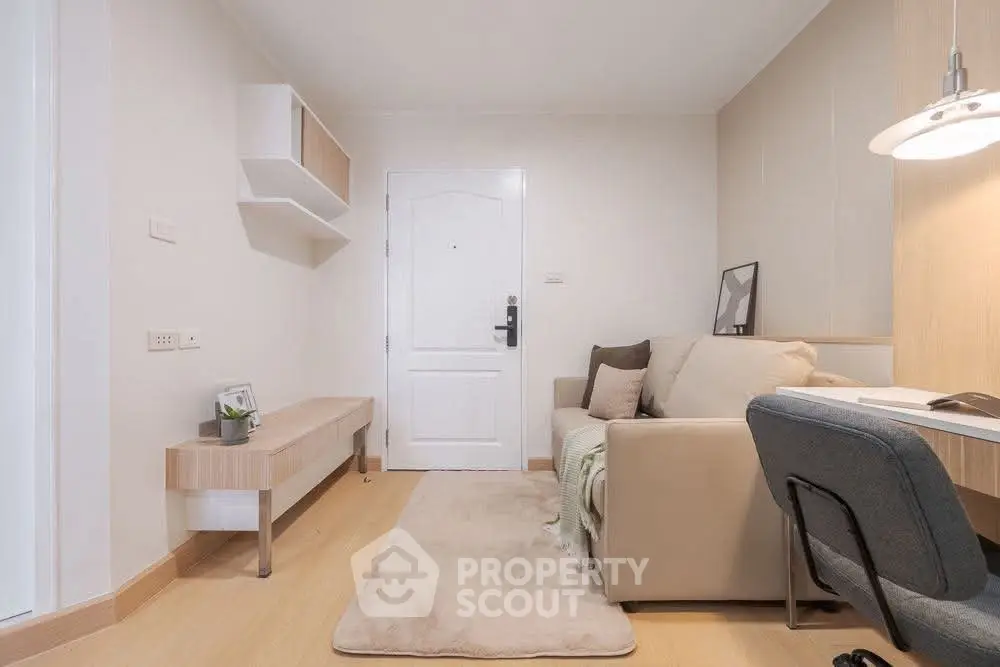 Cozy living room with modern decor and comfortable seating in a stylish apartment.