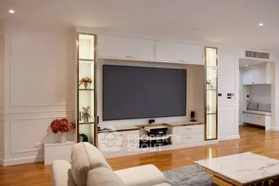 Luxurious living room with modern entertainment center and elegant decor