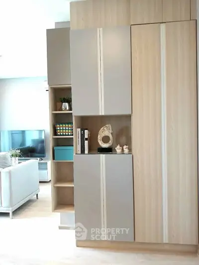 Modern living room with stylish shelving and neutral decor