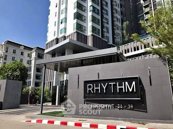 Modern high-rise building exterior with sleek design at Rhythm Sukhumvit 36-38.