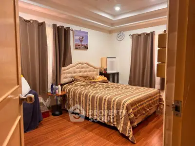Cozy bedroom with elegant decor and plush bedding in a stylish home