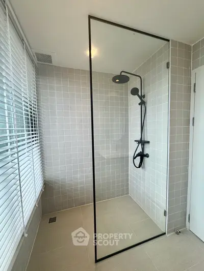 Modern bathroom with sleek glass shower and stylish tile design