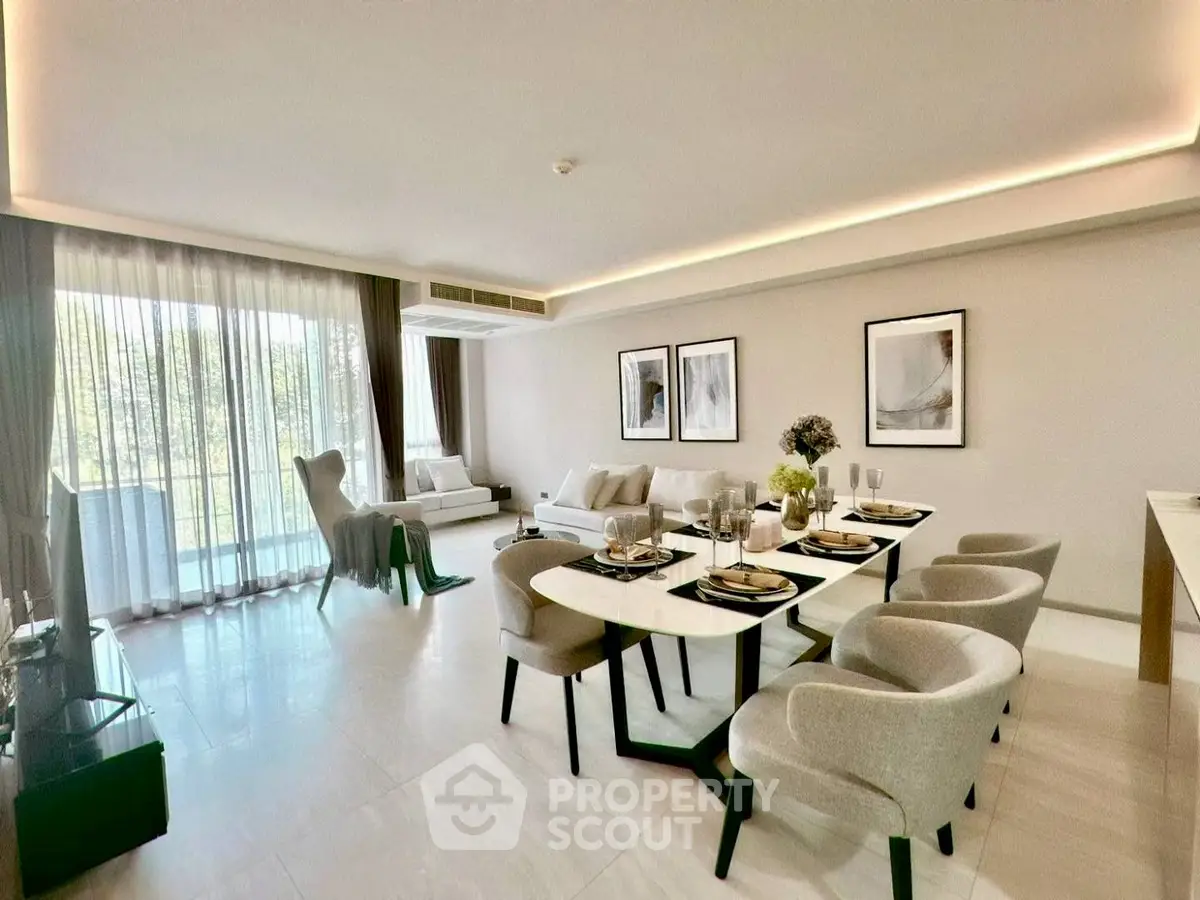 Spacious modern living room with elegant dining area and large windows.