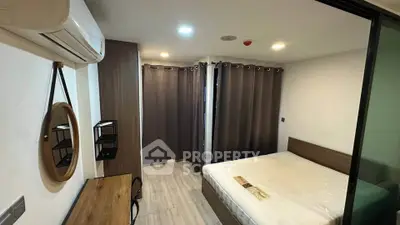 Modern bedroom with stylish decor and ample natural light