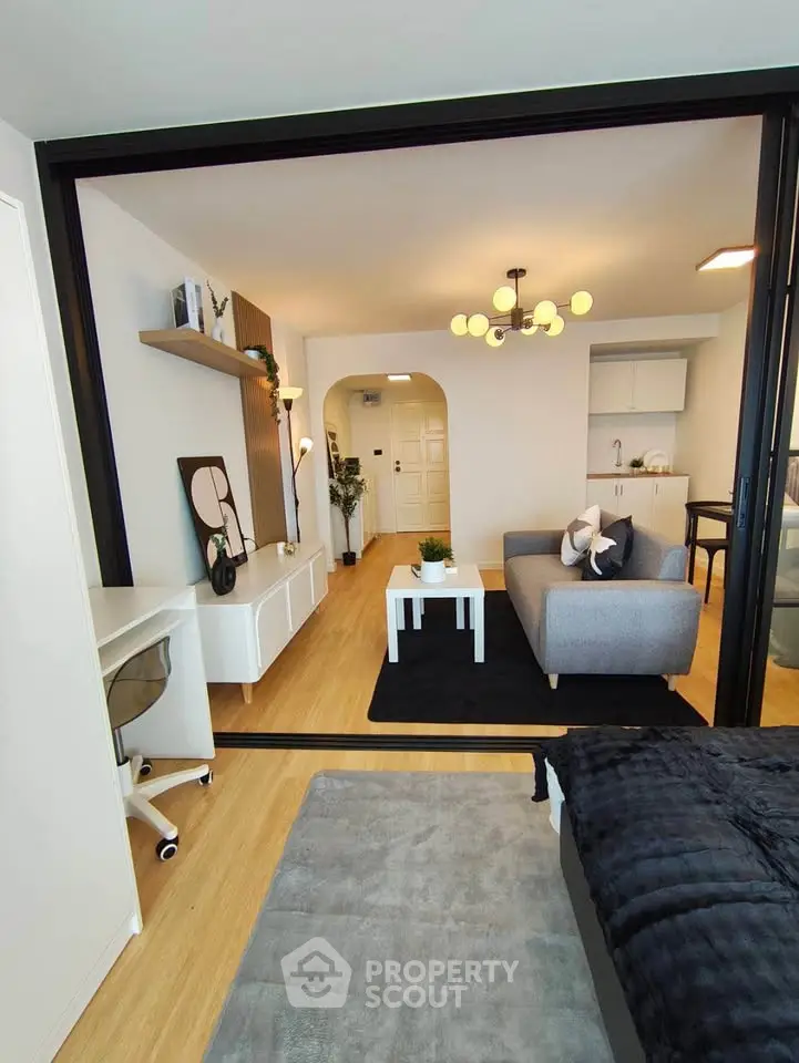 Modern open-plan living room with stylish decor and cozy seating area