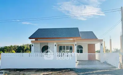 Charming modern bungalow with sleek design and spacious yard, perfect for serene living.