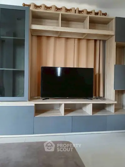 Modern living room with sleek TV unit and stylish storage cabinets