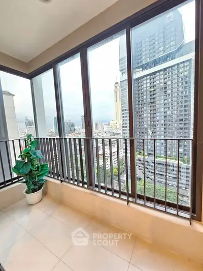Spacious balcony with stunning city view in modern high-rise apartment