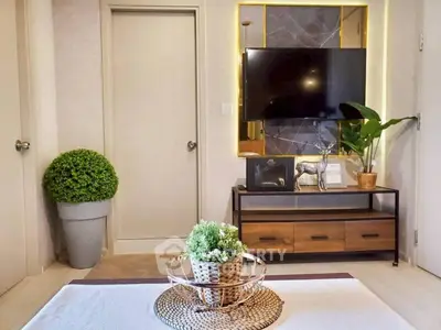 Modern living room with stylish decor and wall-mounted TV
