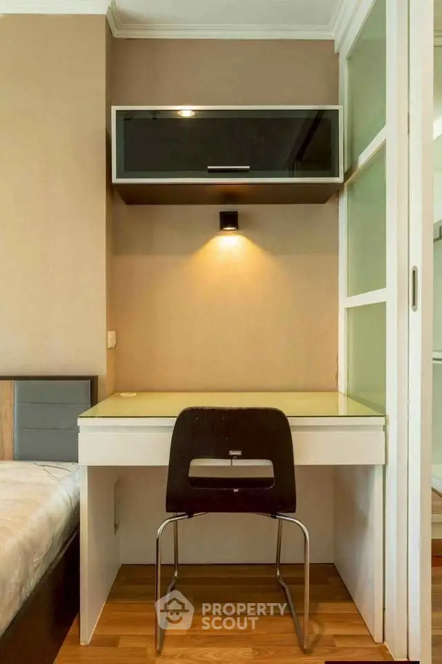 Modern study nook with sleek desk and chair, perfect for compact spaces.