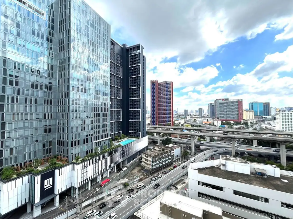 Stunning cityscape view from high-rise building with modern architecture and urban skyline.
