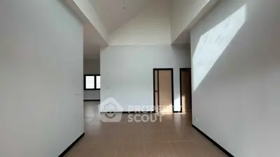Spacious modern interior with high ceilings and natural light