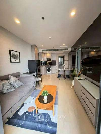 Modern living room with stylish decor and open kitchen layout