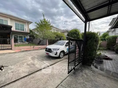 Charming suburban home with driveway and lush greenery, perfect for family living.