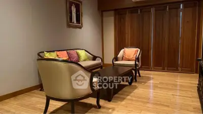 Elegant living room with wooden flooring and classic furniture