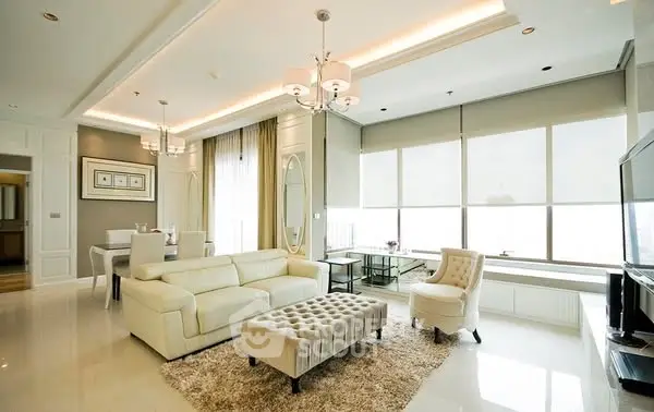Luxurious modern living room with elegant decor and large windows