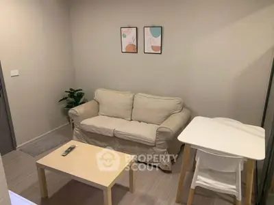 Cozy living room with beige sofa, modern decor, and minimalist furniture for a comfortable lifestyle.
