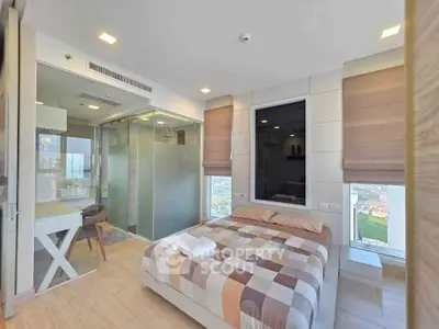 Modern bedroom with glass-walled study and city view in luxury apartment
