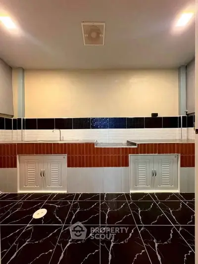 Modern bathroom with unique tile design and dual sinks