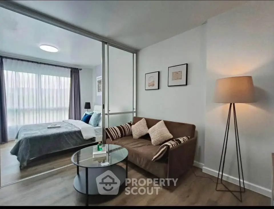 Modern studio apartment with cozy living area and stylish bedroom