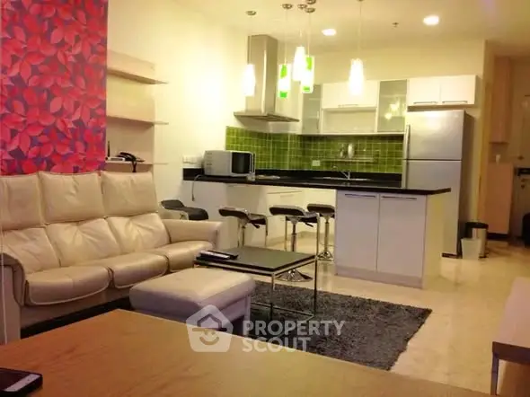 Modern open-layout living room with stylish kitchen and cozy seating area