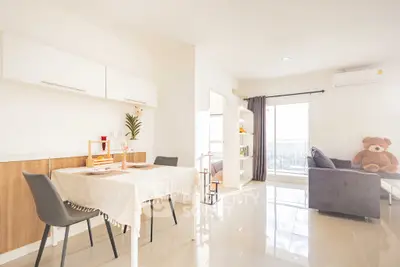 Bright modern living room with dining area and large windows