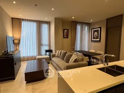 Modern living room with elegant decor and open kitchen layout