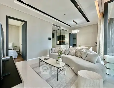 Modern living room with sleek design and cozy furnishings in a luxury apartment.