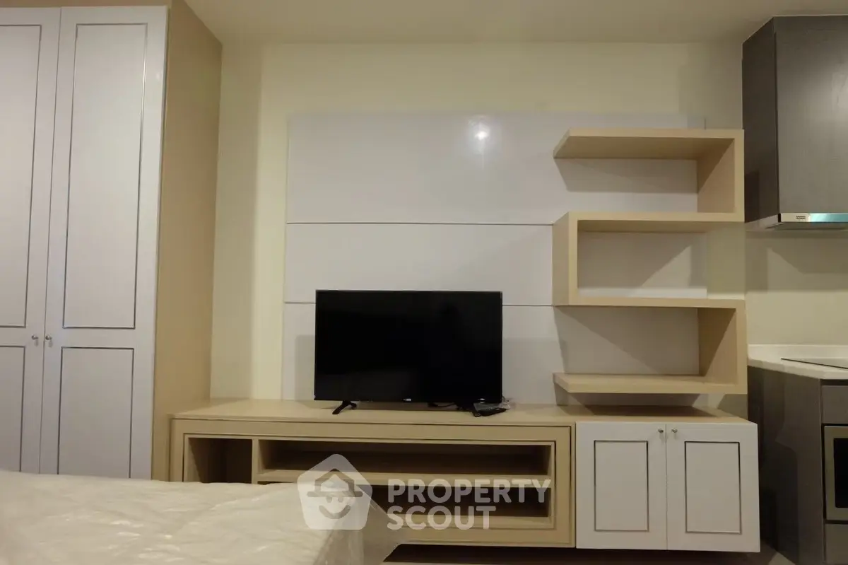 Modern living room with sleek TV unit and stylish shelving