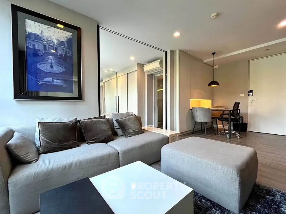 Modern living room with stylish decor and cozy seating area in a contemporary apartment.