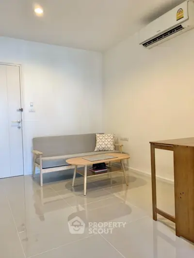 Modern minimalist living room with sleek furniture and air conditioning