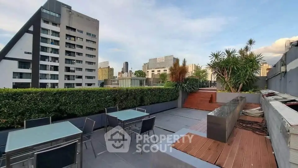 Stunning rooftop terrace with modern seating and city skyline views