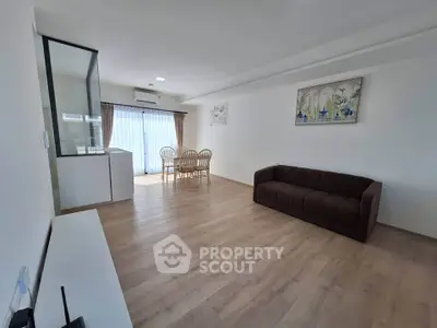 Spacious living room with modern decor and natural light