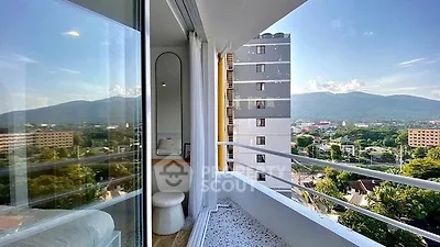Stunning balcony view with mountain backdrop in modern apartment