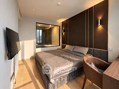Luxurious modern bedroom with elegant decor and large window view