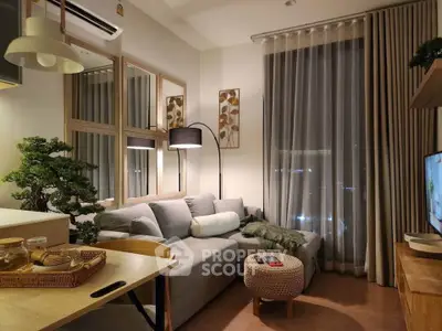 Cozy modern living room with stylish decor and large window view
