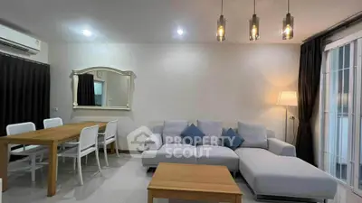 Modern living room with stylish furniture and elegant lighting, perfect for relaxation and entertaining.