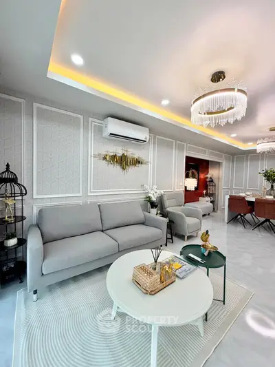Luxurious modern living room with elegant chandelier and stylish furniture