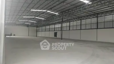 Spacious industrial warehouse with high ceilings and ample natural light