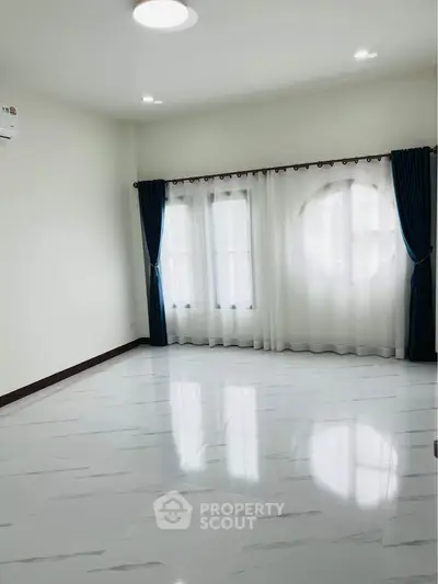 Spacious empty room with elegant curtains and glossy white tiled floor