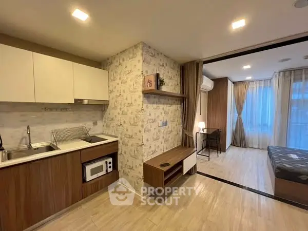 Modern studio apartment with open kitchen and cozy living space