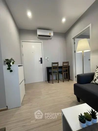 Modern living room with sleek furniture and stylish decor in a cozy apartment.