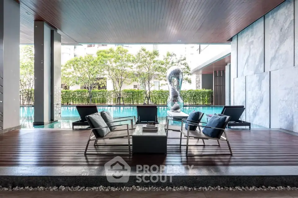 Luxurious poolside seating area with modern design and serene ambiance