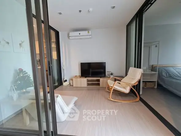 Modern living room with sliding glass doors and cozy furniture